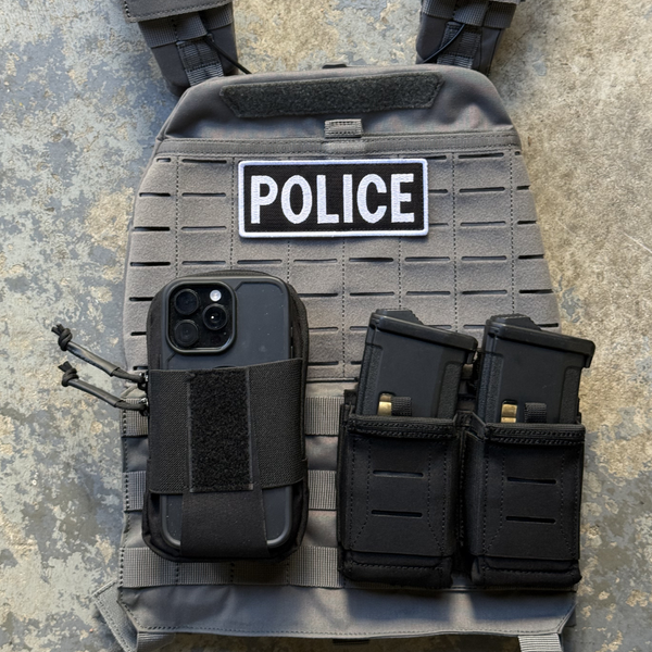 Kanga Systems Trace Phone Pouch with external smartphone retention system, Cordura® construction, rear storage compartment and MOLLE-compatible mounting.